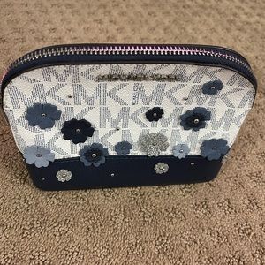Michael Kors Floral make up case.